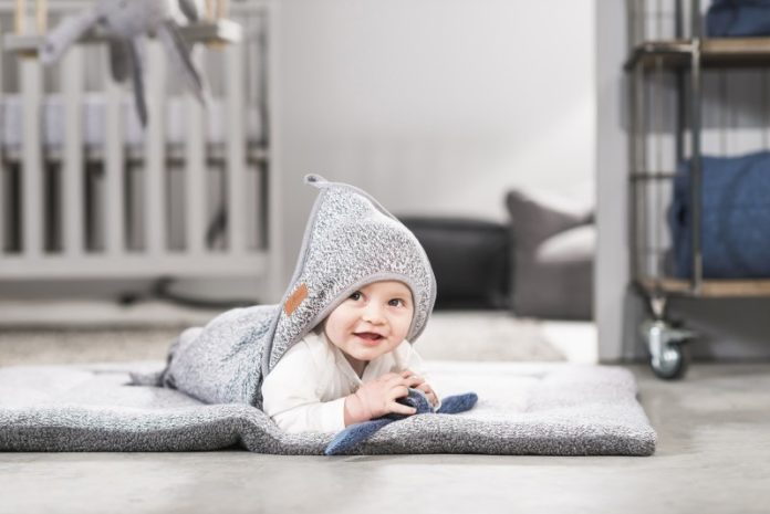 baby in a jollien blanket